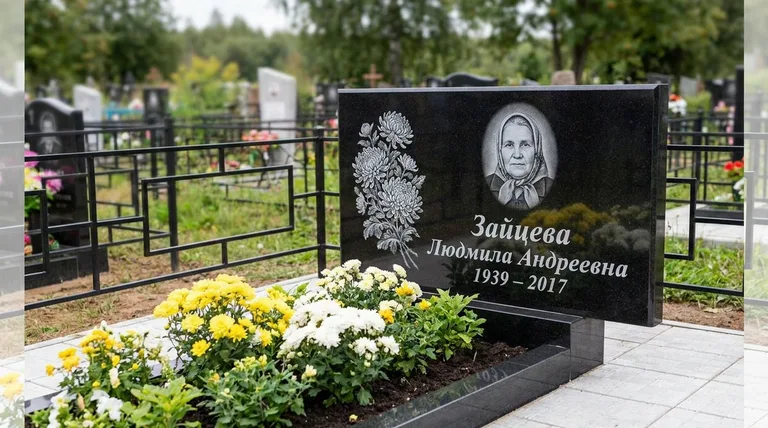 Памятник с гравировкой хризантем — выполненная работа «Зайцева» в Красноярске